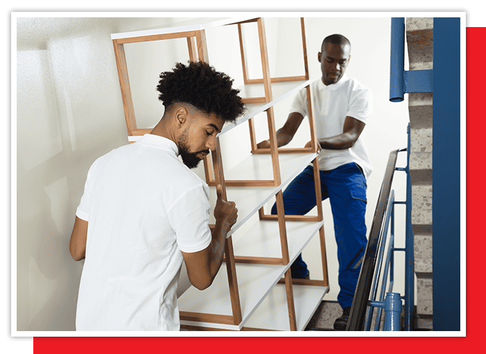 Movers taking furniture down some stairs | reno moving long distance services | reno moving near me