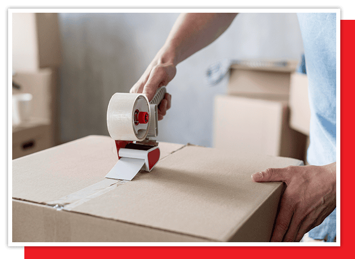 image of a man taping up a box